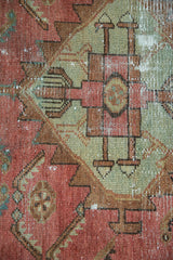 Antique Malayer rug detail: gem blush, pale copper green geometric 'pawn' motif, even wear.