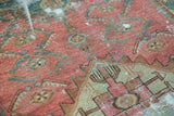 Detail of antique Malayer runner, showing worn serrated leaf border with blush, pale copper green, and foundation etching.