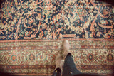 Antique Mahal rug, Mustafi design with scrolling vines, animal motifs, and ornate multi-layered border.