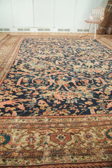 Antique Persian Mahal carpet: intricate Mustafi design with indigo, terra cotta, and beige border.
