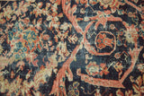 Antique Mahal carpet with storied texture, featuring coral floral Mustafi design on indigo.