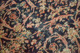 Antique Mahal rug's Mustafi design with scrolling vines, floral motifs, terra cotta, and indigo.