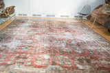Vintage Persian Mahal carpet's faded allover floral bouquet, featuring dusty rose and antique ivory tones.