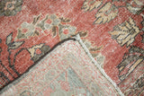 Faded cinnabar pile texture, visible foundation, and hand-knotted reverse of vintage Mahal carpet.