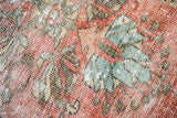 Vintage Mahal carpet pile, faded cinnabar, sky blue, charcoal, with even wear exposing foundation.