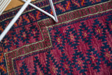 Geometric serrated gul pattern in unusual violet purple, navy blue, and chocolate brown border.