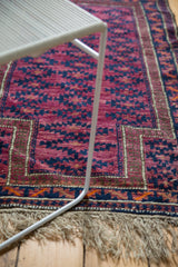 Vintage Belouch rug with violet purple, navy gul pattern, chocolate brown border, fringe.