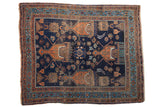 Antique Persian Afshar square rug: indigo field, starburst medallion, planted vase motifs, 4'1