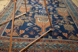 Antique Afshar rug texture showing even wear, indigo field, terra cotta and blue motifs.