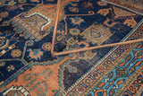 Antique Afshar rug detail: geometric patterns in indigo and rust, showing mostly even wear.