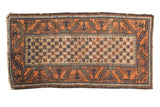 Vintage Belouch rug with pale rust, charcoal, and ivory lattice starburst design.