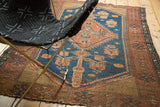 Rust orange elongated cyprus tree motif on teal blue vintage Kurdish Malayer rug.