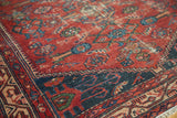 Vintage Malayer runner with indigo Mir Serbend border, red floral field, visible wear, and fringe.