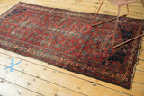 Cherry red vintage Malayer rug corner, Mir Serbend border, semi-herati motifs, visible foundation.
