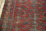 Vintage Malayer runner's cherry red field, Mir Serbend border, semi-herati motifs, and even wear.