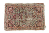 Antique Kerman rug mat, oblong medallion, cochineal red and ivory mil fleur design.