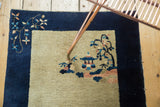 Vintage 1920s Peking rug's pictorial house, tree motif, and blue-blush floral border.