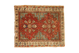 Antique Caucasian rug with terra cotta diamond medallions and blue, ivory geometric patterns.