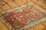 Secured edge of the Antique Caucasian rug, showing stepped spandrel and floral border.