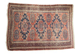 Vintage Caucasian Soumac carpet, elongated triple navy medallion, madder red, blush, nuanced etching.