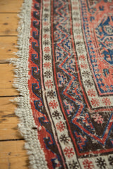 Original macramae ends and tattered side of a vintage Caucasian Soumac rug.