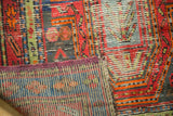 Hand-knotted geometric pile and multi-colored woven back of a vintage Caucasian rug.