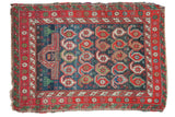 Antique Caucasian rug: abrash indigo field, unique botehs, prayer mehrab, and starburst border.