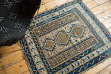 Geometric borders and pearl fills in cobalt blue, brown, and mauve on a vintage Caucasian rug.