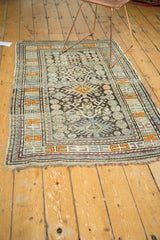 Corner of antique Caucasian rug with original secure selvage, even wear, and geometric tangerine border.