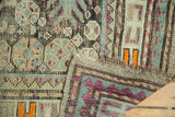 Antique Caucasian rug corner shows geometric pattern, worn pile, visible foundation, secure selvage.