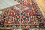 Vintage Karaja rug, rectilinear primitive medallion with geometric flowers, red and navy.