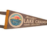 Vintage gray felt pennant with 'Beautiful Lake Champ Ferry Crossings' and stitched ferry lake scene.