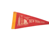 Vintage red felt pennant with Empire State Bldg, Statue of Liberty, and yellow binding.