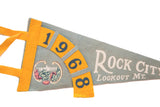 Vintage Rock City Lookout Mountain felt flag close-up, yellow 1968 date, colorful graphic.