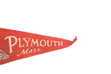 Vintage red felt pennant showing the curled tip and partial white 'MOUTH' text.