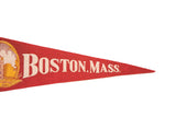 Red felt pennant showing 'Boston, Mass.' in cream lettering and its pointed tip.