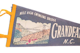 Vintage blue felt pennant, Grandfather Mountain bridge illustration, yellow trim, 8x26 inches.