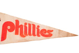 Vintage cream felt pennant with red Phillies lettering and pointed tip.