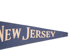 Vintage New Jersey felt flag pennant, displaying 'Jersey' text on dark blue.