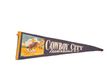 Vintage Cowboy City Farmingdale NJ felt pennant with multicolor cowboy, horse, and town graphic, 8x26.