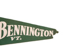 Vintage green felt Bennington VT. pennant with white lettering and worn edge.