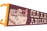 Vintage Old Abilene Town felt flag features cowboys, 1869 general store, with yellow trim.