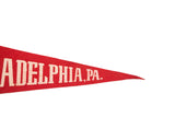 Vintage red felt pennant showing cream 