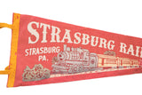 Red felt vintage Strasburg Railroad pennant, white letters and yellow edge.