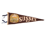 Antique Sussex N.J. felt pennant, brown with cream lettering and a vintage landscape emblem.