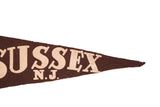 Brown felt pennant tip with cream 'USSEX N.J.' lettering.
