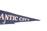 Blue felt vintage pennant tip with cream 'CITY' lettering and soft edges.