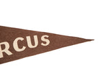 Vintage brown felt flag's pointed tip with partial cream 'RCUS' lettering.