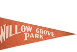 Orange felt vintage pennant with white 'GROVE PARK' lettering and pointed end.