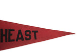 Pointed end of a vintage red felt flag with black 'EAST' lettering.